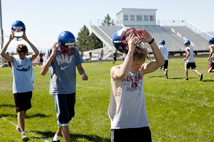 &lt;p&gt;Sophomore Boyd Rieke takes his helmet off after running &quot;snake
drills&quot; during Bigfork High School football practice last Wednesday
morning.&lt;/p&gt;