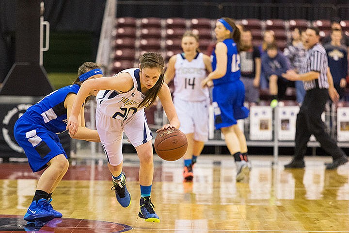 &lt;p&gt;With her head down, Allison Kirby dribbles up the court in the first quarter.&lt;/p&gt;