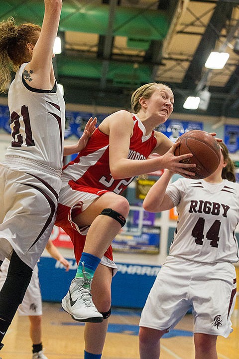 &lt;p&gt;Grace Kirscher drives past Rigby&#146;s Tori Anderson, left, before being fouled in the fourth quarter.&lt;/p&gt;