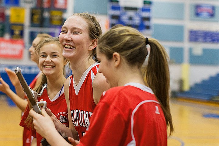 &lt;p&gt;Sandpoint High School&#146;s Grace Kirscher reacts with teammates after beating Rigby for third place in the state 4A girls basketball tournament Saturday in Boise.&lt;/p&gt;