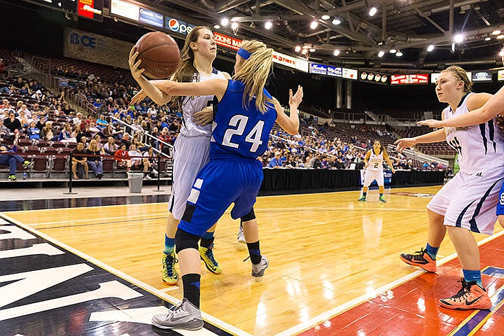 &lt;p&gt;Timberlake guard Payten Rhodes passes the ball around Sugar-Salem&#146;s Jessie Harris in the fourth quarter of the 2015 state 3A girls basketball championship game Saturday at the Idaho Center in Nampa.&lt;/p&gt;