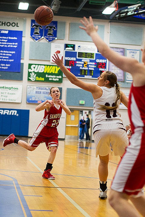 &lt;p&gt;Sandpoint guard Riley Couch makes a pass from the top of the key during the second quarter in Boise.&lt;/p&gt;