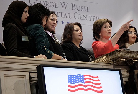 &lt;p&gt;Former First Lady Laura Bush, second from right, rings the opening bell at the New York Stock Exchange before in New York, Tuesday, Feb. 21, 2012. U.S. stocks are opening higher and the Dow Jones industrial average is nearing 13,000 after Greece secured a bailout deal to keep it from default. (AP Photo/Seth Wenig)&lt;/p&gt;