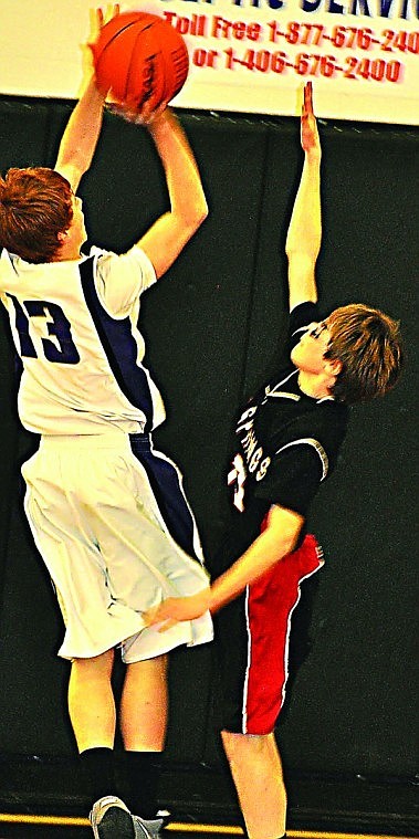 &lt;p&gt;Jarod White of Hot Springs (right) attempting a block shot
against Charlo.&lt;/p&gt;