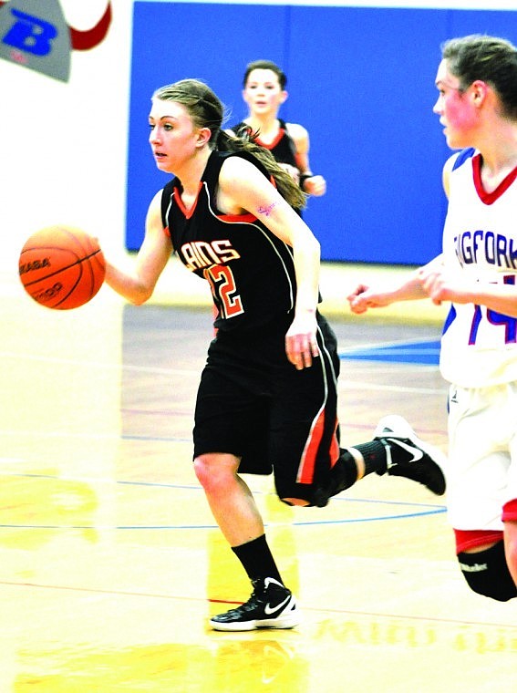 &lt;p&gt;Kelsey Beagley of Plains (left) charging up the court against
Bigfork.&lt;/p&gt;