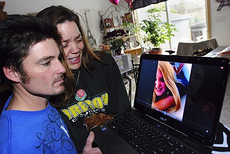 &lt;p&gt;AP Photo/Jeff Barnard Loriann Earp cries with her husband, Justin Earp, on Wednesday at their home in Eagle Point, Ore., as they view photos of their daughter, Ashley Long, 14, who died after inhaling helium at a party. The Earps hope their daughter's death will help spread the word about the dangers of inhaling helium.&lt;/p&gt;