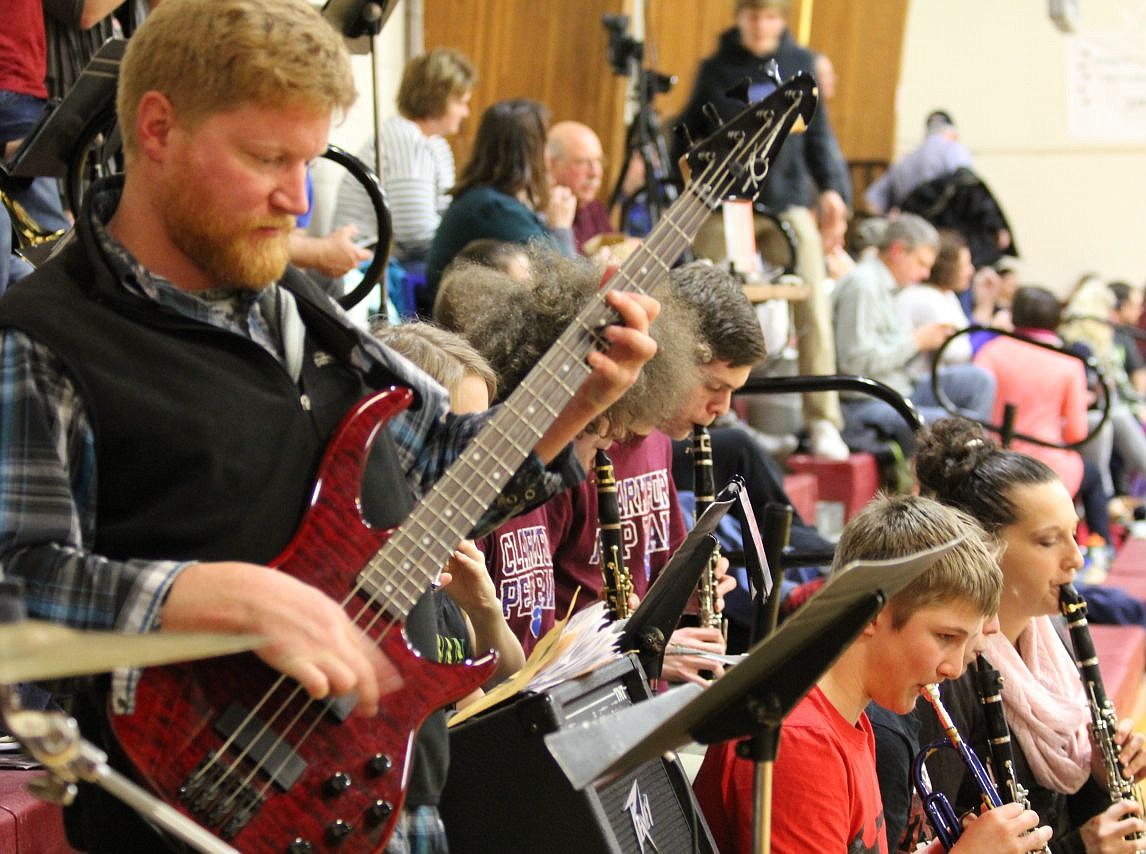 <p></p><p>Alberton music teacher Mike Wolfe plays bass for the pep band at a basketball game. His co-band leader, Superior’s music teacher Amber Winter, plays the clarinet to the right of Wolfe. (Kathleen Woodford/Mineral Independent)</p>