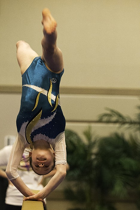 &lt;p&gt;Madi Whittemore, 10, practices her routine on the balance beam before Friday's competition.&lt;/p&gt;