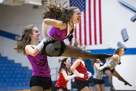 &lt;p&gt;Shelby Senn of Lakeland Hawk Synergy dance team leaps into the air, assisted by Alyssa Adams, left, during the props category of the state qualifying dance competition Saturday at Coeur d&#146;Alene High School.&lt;/p&gt;