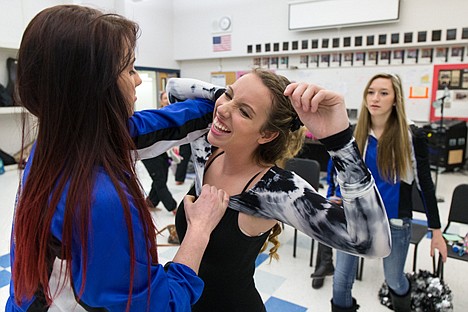 &lt;p&gt;Krissy McCaughan, right, laughs as Shelby Hartline helps her put on the Coeur d&#146;Alene Vikettes hip hop outfit Saturday as the team gets ready to compete against regional High School dance teams for a shot at qualifying for the state competition.&lt;/p&gt;