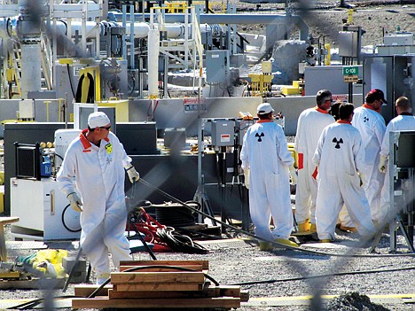 &lt;p&gt;Workers at the Hanford nuclear reservation work around a a tank farm where highly radioactive waste is stored underground near Richland, Wash. on July 14 2010.&lt;/p&gt;