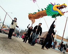 Hot Springs residents celebrated the Chinese New Year Saturday afternoon with a parade featuring a 30 foot hand made dragon.  A group of people carried the dragon, led by Matt Lonergan, as others danced and paraded down Main Street to Circle Square Park.