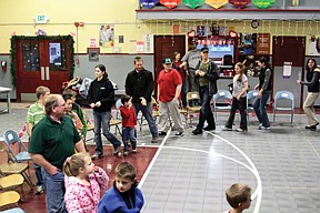 Families and students did the cakewalk at Paradise School's winter carnival Thursday evening.