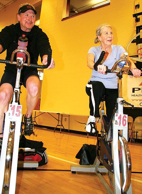 &lt;p&gt;Jim Fulton, left, and Mary Kuipers, both of Post Falls, pedal during the Riding for Rover fundraiser on Friday.&lt;/p&gt;