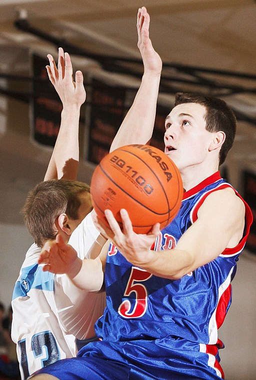 &lt;p&gt;Bigfork senior Seth Roessmann (5) lays the ball up past a Loyola defender Friday afternoon during the Vikings' win over Loyola in a semifinal game of the Western B Divisional Tournament at Flathead High School. Friday, Feb. 22, 2013 in Kalispell, Montana. (Patrick Cote/Daily Inter Lake)&lt;/p&gt;