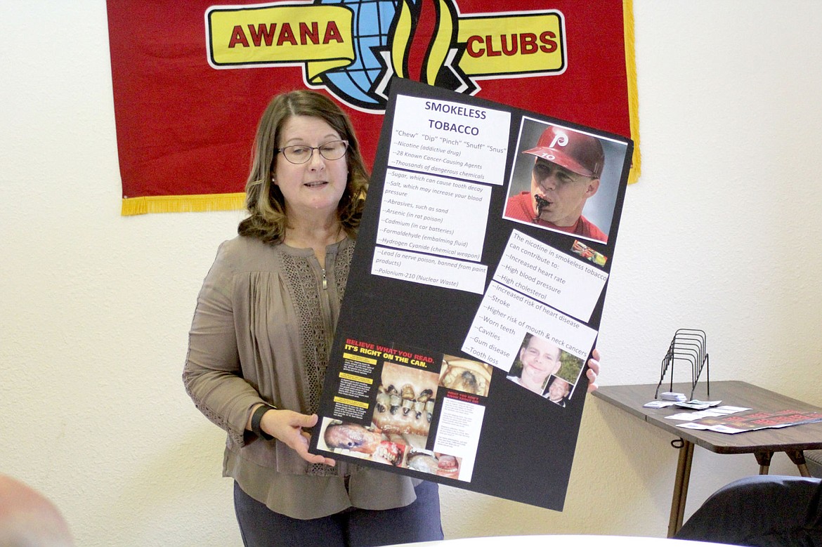 &lt;p&gt;&lt;strong&gt;Sandy Gubel shows a poster demonstrating the effects of smokeless tobacco during the Thompson Falls Chamber of Commerce meeting.&lt;/strong&gt;&lt;/p&gt;
