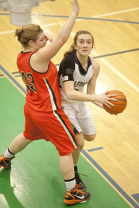 &lt;p&gt;Glacier&#146;s Rachel Cherry (right) puts up a shot while pressured by Flathead&#146;s Jenessa Heine (43) during Glacier&#146;s victory over Flathead in the crosstown matchup at Glacier High School Friday night.&lt;/p&gt;