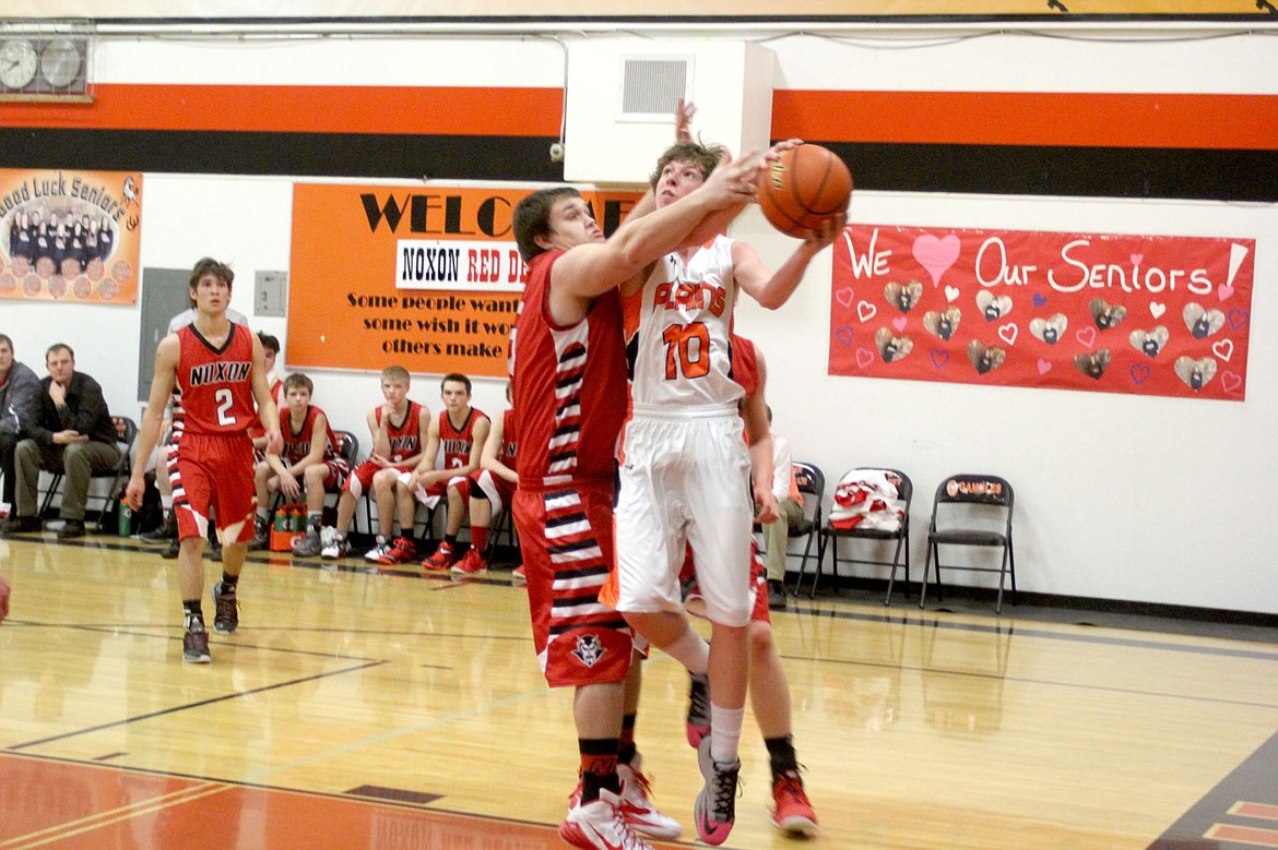 &lt;p&gt;&lt;strong&gt;Ryan Ovitt dodges one of Noxon&#146;s players to take a shot during the Plains senior night earlier this season.&lt;/strong&gt;&lt;/p&gt;