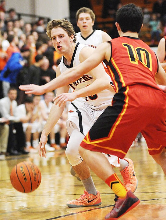 &lt;p&gt;Flathead's Alex Croymans drives past Missoula Hellgate's Peter Vandam during the second quarter at Flathead on Tuesday. (Aaric Bryan/Daily Inter Lake)&lt;/p&gt;