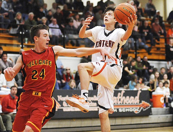 &lt;p&gt;Flathead's Matt Marshall drives past Missoula Hellgate's Devin Bray during the 2014-15 season in this file photo. (Aaric Bryan/Daily Inter Lake)&lt;/p&gt;