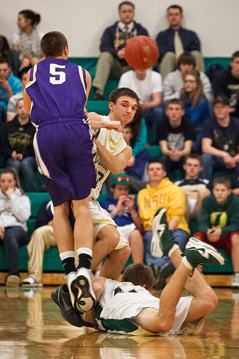 &lt;p&gt;Cole Sampson, of St. Maries, braces himself as Kellogg High School's Garret Wendt flies into the air while making a pass in the third quarter.&lt;/p&gt;