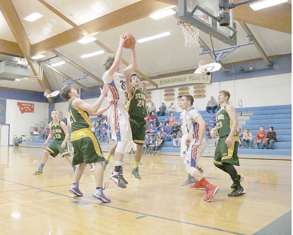 &lt;p&gt;Luke Boyce grabs a rebound during a recent game against cross-county rivals St. Regis.&lt;/p&gt;