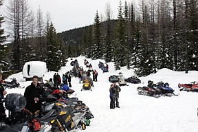 Riders gathering at the warming hut to take a break from the action during the Cabinet Ridge Riders Poker Run last Saturday in Trout Creek.