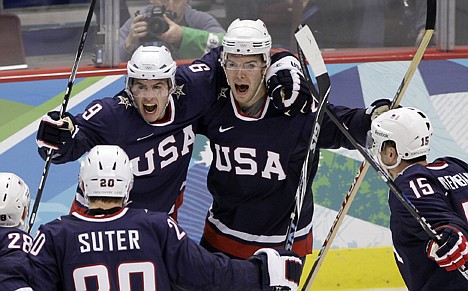 &lt;p&gt;USA's Zach Parise (9) is congratulated by teammates after scoring a goal in the third period of the quarterfinal game against Switzerland at the Winter Olympics in Vancouver, British Columbia, on Wednesday.&lt;/p&gt;