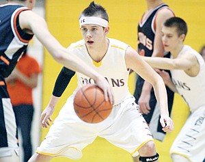 <p>Gage Tallmadge guarding Plains' Kyle Revier during District 7B basketball tournament 2-22-14.</p>