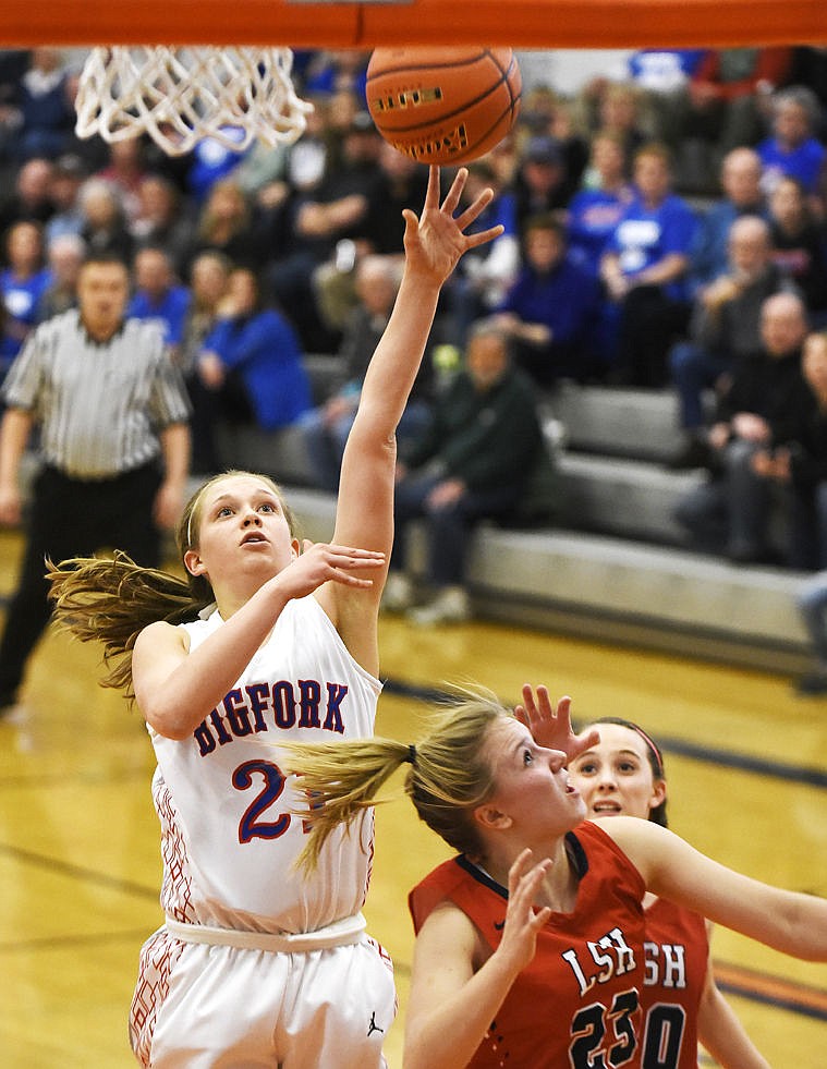 &lt;p&gt;Bigfork's Rakiah Grende shoots over Loyola's Brook Kolar (23) and Payson Jacobson to score a basket during the second quarter of the Valkyrie' 43-42 loss in the opening round of the Western B Divisionals at Flathead on Thursday. (Aaric Bryan/Daily Inter Lake)&lt;/p&gt;