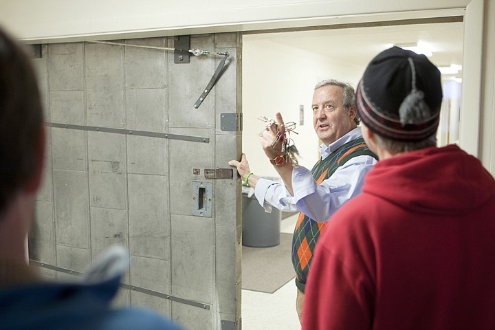 &lt;p&gt;Principal Dave Carlson points out the lack of fire sprinklers in the hallway while showing off the firewall during an open house at Whitefish High School Thursday afternoon.&lt;/p&gt;