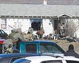 FOUR PEOPLE ARRESTED IN QUINCY RAID
