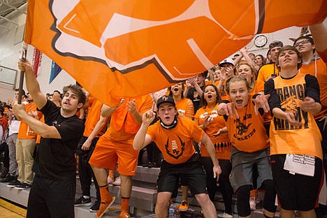 &lt;p&gt;PFHS Senior, Triston Valente waves the victory flag as Post Falls wins the championship and is now on to state, Tuesday at the PFHS Arena.&lt;/p&gt;