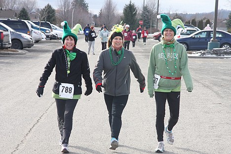 &lt;p&gt;Friends Melanie Simpson, left, Judy Hirschkorn, center, and Susan Cliff are dressed for fun in Sunday's Leprechaun Scurry.&lt;/p&gt;