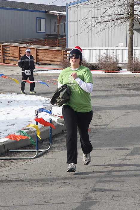 &lt;p&gt;Kristine Miller of Coeur d'Alene runs to the finish line of Sunday's Leprechaun Scurry.&lt;/p&gt;