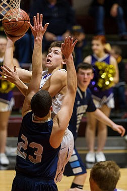 &lt;p&gt;Kellogg&#146;s Chase Jerome puts up a fourth quarter score over Bonner Ferry&#146;s Wyatt Nelson in the 3A District 1 tournament championship game at North Idaho College.&lt;/p&gt;