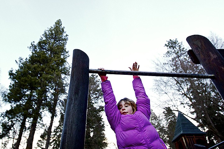 &lt;p&gt;JEROME A. POLLOS/Press Taking full advantage of the warmer-than-usual winter weather, Isabella Braun, 12, hangs from one of the play structures Monday at the City Park in downtown Coeur d'Alene.&lt;/p&gt;