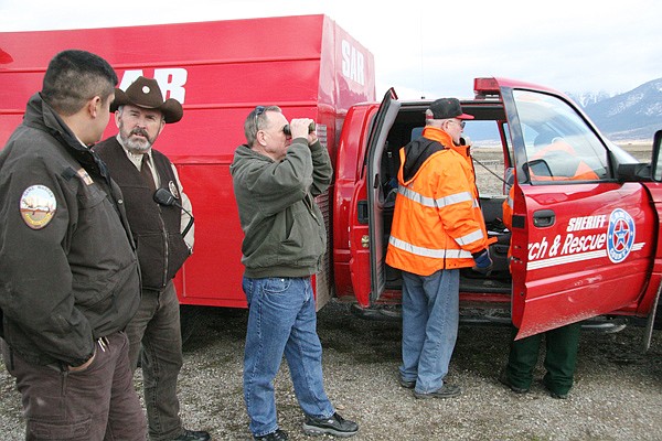 Members of Tribal Fish and Game and Lake County Search and Rescue try to locate a group of stranded skiers on Mount St. Mary's in St. Ignatius. Once located, the three men were found to be uninjured.