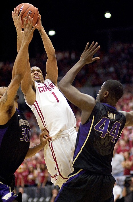 &lt;p&gt;Washington State guard Reggie Moore (1) drives between Washington's Desmond Simmons (30) and Darnell Gant for a layup during the first half Saturday at Pullman.&lt;/p&gt;