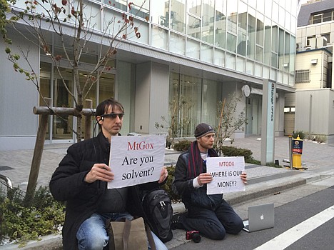 &lt;p&gt;Bitcoin trader Kolin Burges, right, of London and American Aaron (only his first name was given) hold protest signs as they conduct a sit-in in front of the office tower housing Mt. Gox in Tokyo Tuesday.&lt;/p&gt;