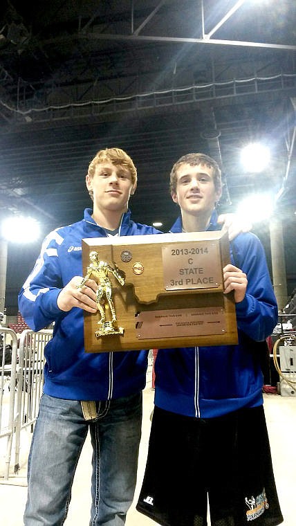 <p>Bridger Lapierre poses with Anthony Parkin and the team's plaque. Superior took third place in Class C, while Parkin took fourth individually.</p>