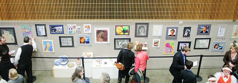 &lt;p&gt;Attendees view artwork by local high school students Monday night during An Evening of Fine Arts at Flathead Valley Community College. (Patrick Cote/Daily Inter Lake)&lt;/p&gt;