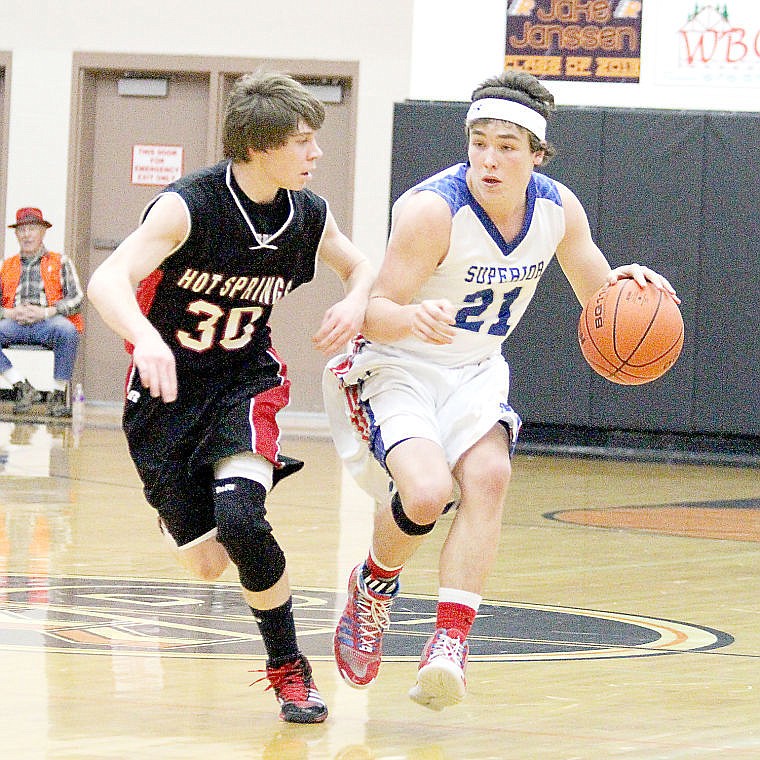 &lt;p&gt;Tanner Smith, guarded closely by Jarod White, rushes the ball past half court in Superior's win over Hot Springs.&lt;/p&gt;