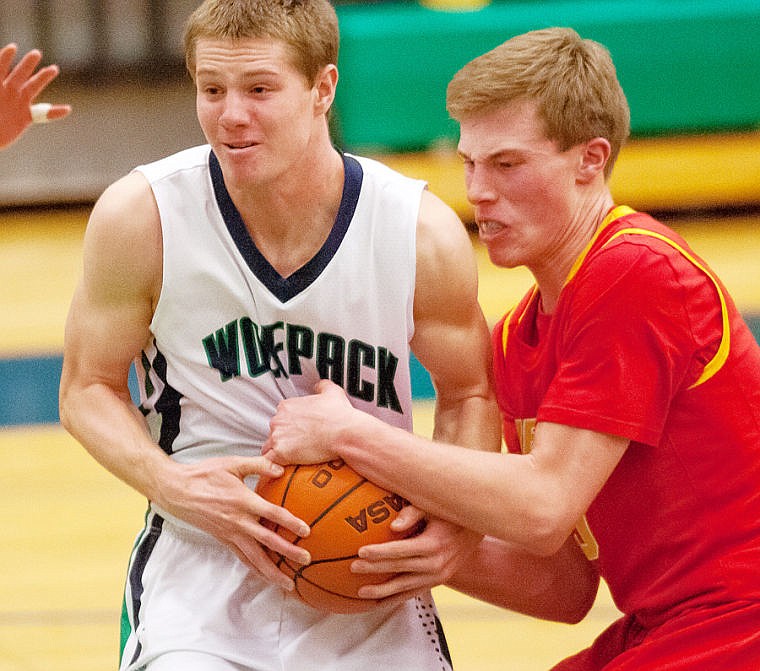 &lt;p&gt;Missoula Hellgate junior forward Rhett Baerlocher (right) ties up the ball as Glacier junior wing Sam McCamley (3) drives to the hoop Tuesday night during Glacier's loss at home to Missoula Hellgate. Feb. 25, 2014 in Kalispell, Montana. (Patrick Cote/Daily Inter Lake)&lt;/p&gt;