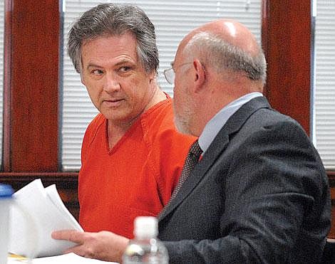 Photo by Jennifer McBride Douglas Guill confers with his lawyer, Michael Sherwood at court in Polson. His trial date was scheduled to begin Monday, March 3, in Thompson Falls.