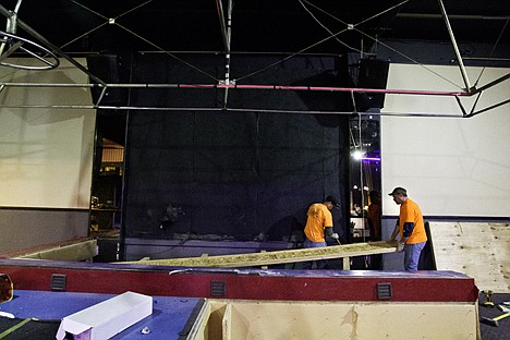 &lt;p&gt;Amos Dodson, right, holds a support beam as foreman Joe Reasor uses a crowbar to separate a board while disassembling the stage at the former Rendezvous night club.&lt;/p&gt;