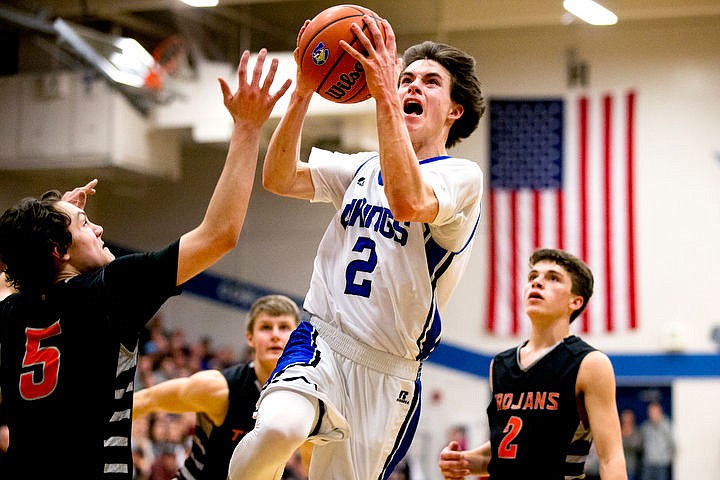 &lt;p&gt;Coeur d'Alene's Brody Lundblad fights towards the basket past Post Falls' Max McCullough (5) at the 5A Region 1 second-place game on Thursday, Feb. 25, 2016 at Coeur d'Alene High School. Post Falls defeated Coeur d'Alene 77-70.&lt;/p&gt;