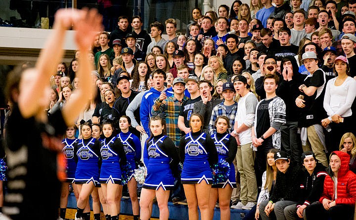 &lt;p&gt;The Coeur d'Alene student section jeer at Post Falls' Max McCullough as he attempts a free throw at the 5A Region 1 second-place game on Thursday, Feb. 25, 2016 at Coeur d'Alene High School. Post Falls defeated Coeur d'Alene 77-70.&lt;/p&gt;