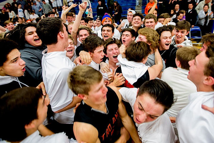 &lt;p&gt;Post Falls students storm the court after their team defeated Coeur d'Alene 77-70 at the 5A Region 1 second-place game on Thursday, Feb. 25, 2016 at Coeur d'Alene High School.&lt;/p&gt;