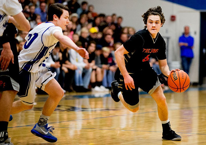 &lt;p&gt;Post Falls' Max McCullough drives to the key past Coeur d'Alene's Justin Kofmehl at the 5A Region 1 second-place game on Thursday, Feb. 25, 2016 at Coeur d'Alene High School. Post Falls defeated Coeur d'Alene 77-70.&lt;/p&gt;